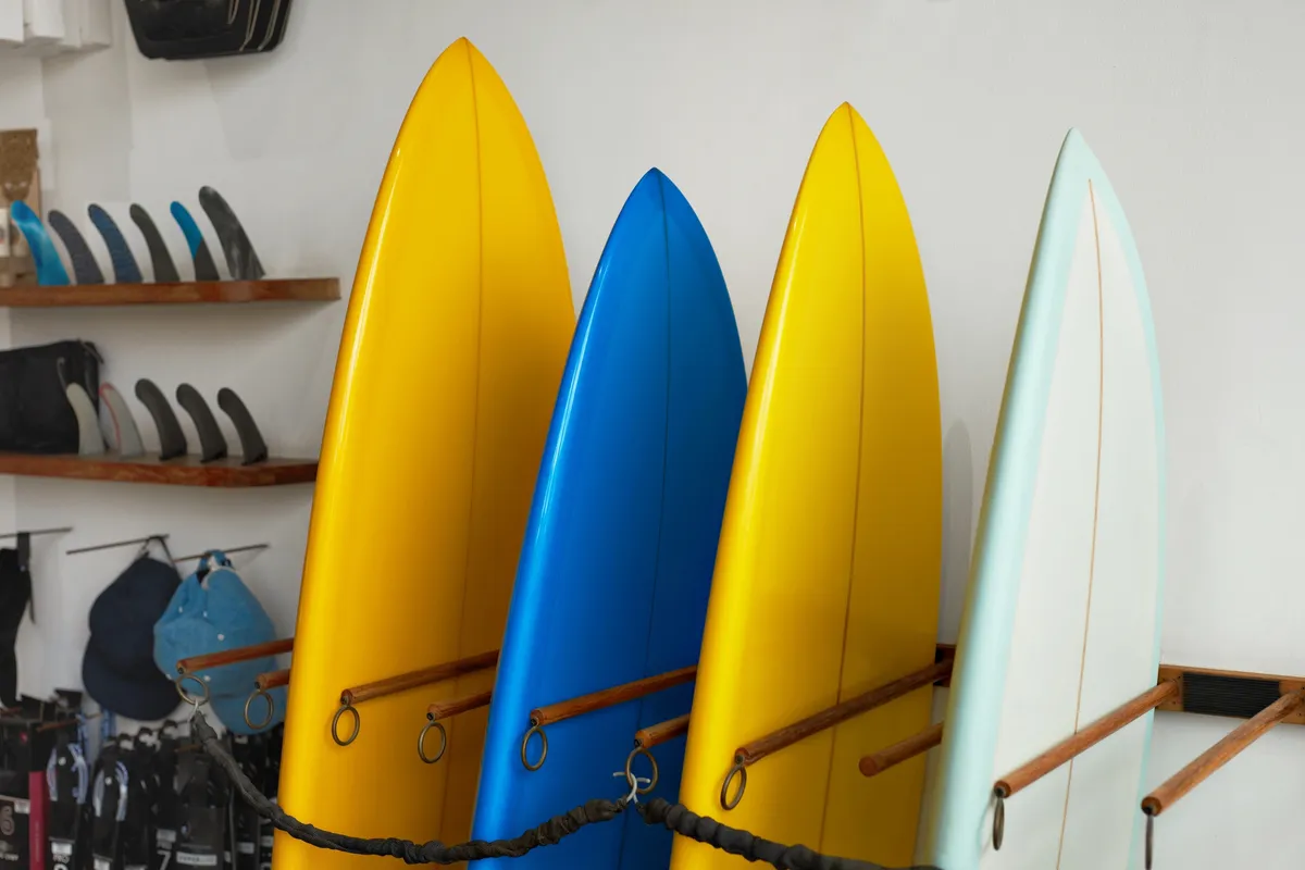 Colorful surfboards lined up at Strictly Surf for the 10 lesson bundle program