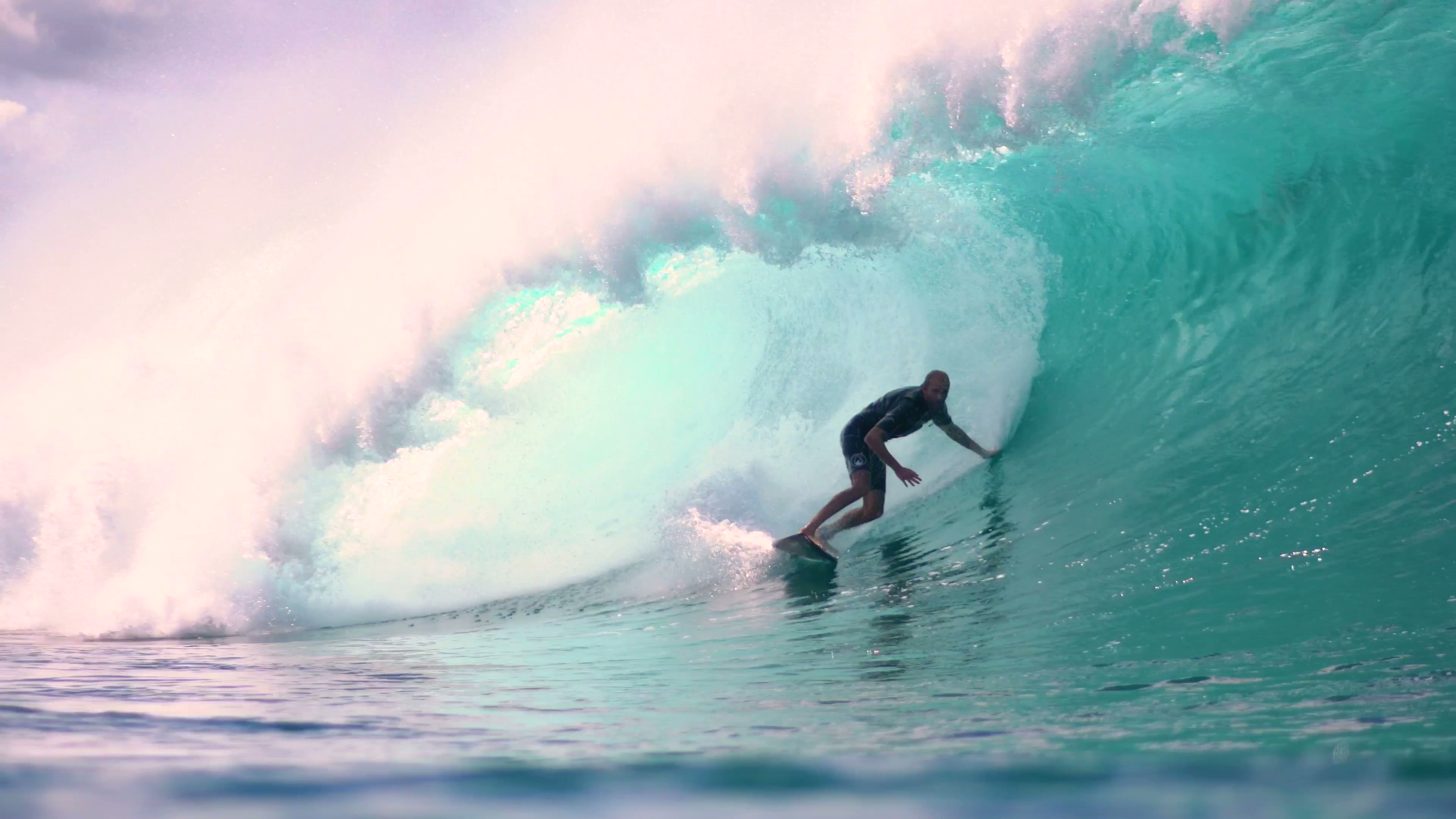 Surfer riding a large wave on Long Island's East End